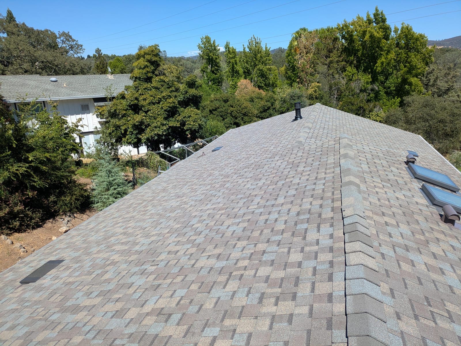 Finished architectural shingle roof after a full roof replacement by KTN Roofing